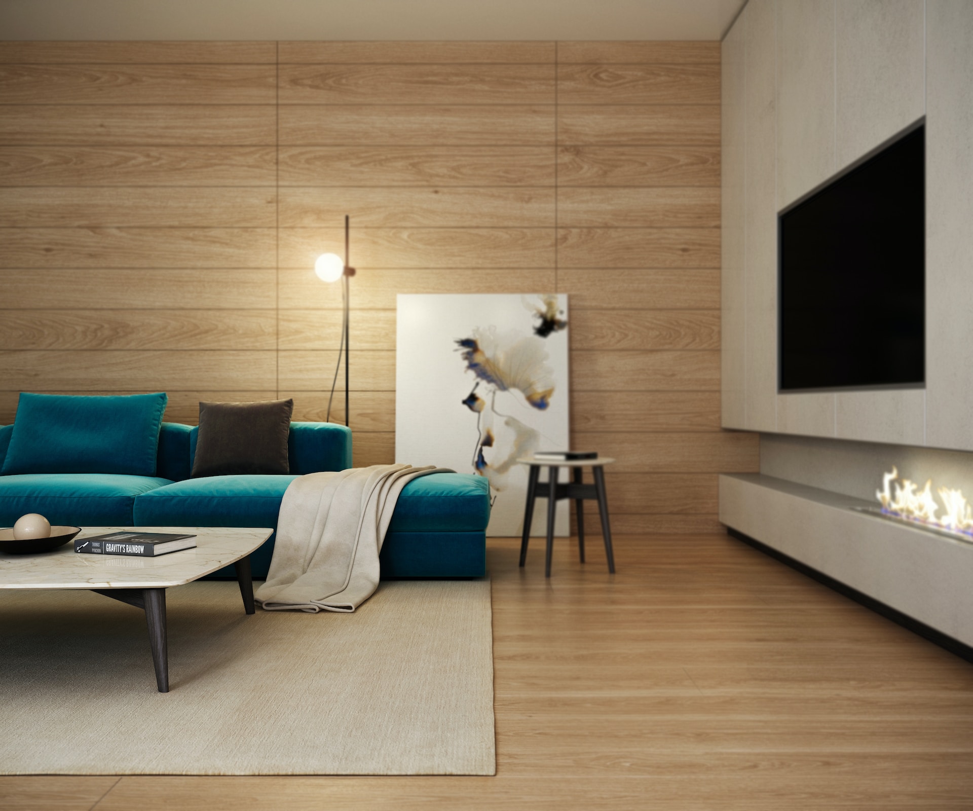 Foto de uma sala moderna, com sofá, um quadro, lampada, lareira e uma TV